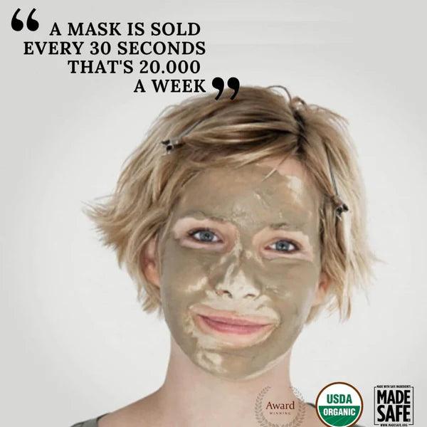 Woman wearing our purifying clay face mask, tightening skin and reducing wrinkles