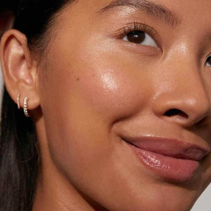 Woman with improved skin after using argan oil