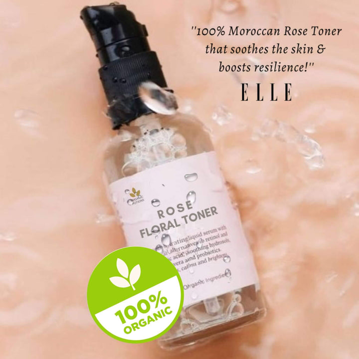 A bottle with white label of 100% organic Moroccan rose floral toner - gently moisturizes, calms irritated skin